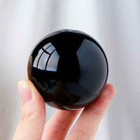 Natural Obsidian Crystal Ball ,  Discover the mystique of the cosmos with a natural obsidian crystal ball, - CRYSTALOIL