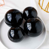 Natural Obsidian Crystal Ball ,  Discover the mystique of the cosmos with a natural obsidian crystal ball, - CRYSTALOIL