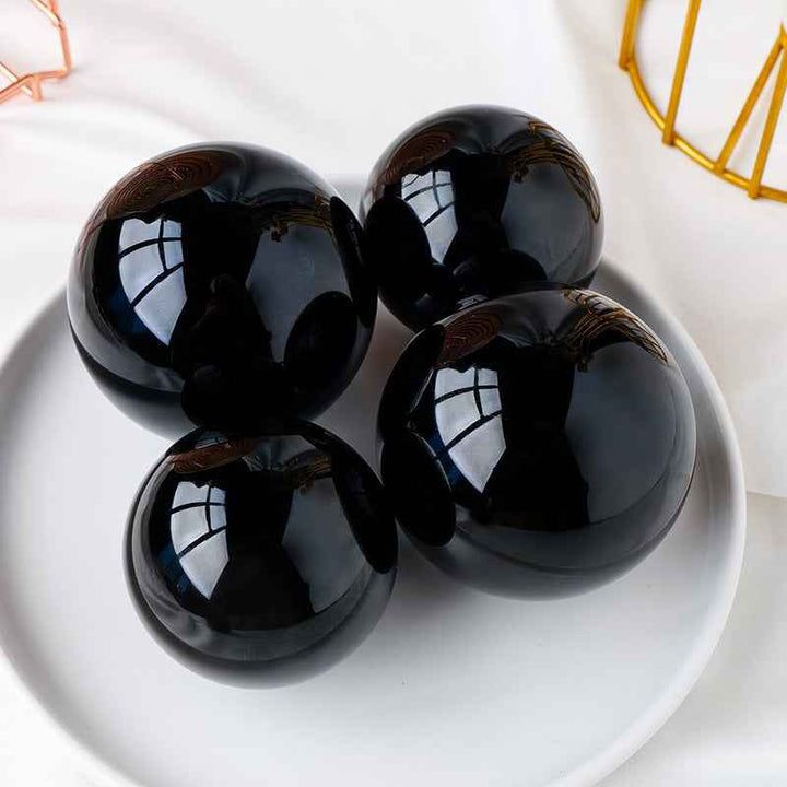 Natural Obsidian Crystal Ball ,  Discover the mystique of the cosmos with a natural obsidian crystal ball, - CRYSTALOIL